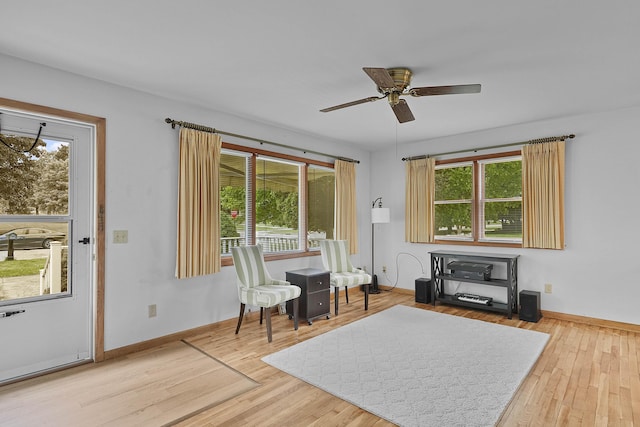 817 Cherry Ave, Big Rapids, MI 49307 - sitting room with plenty of natural light, ceiling fan, baseboards, and wood finished floors