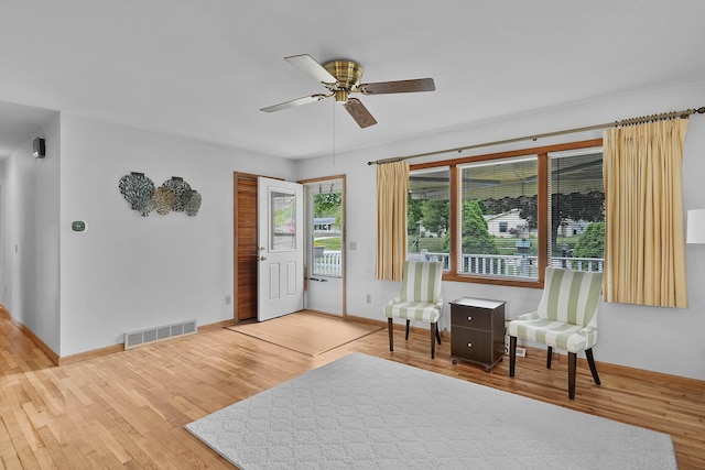 817 Cherry Ave, Big Rapids, MI 49307 - living area featuring wood finished floors, a ceiling fan, and baseboards