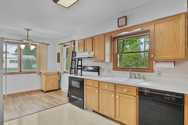 817 Cherry Ave, Big Rapids, MI 49307 - kitchen with black dishwasher, electric range oven, a sink, light countertops, and decorative backsplash