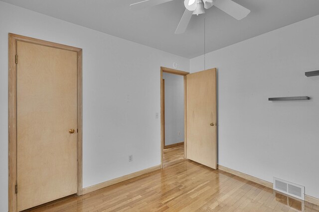 817 Cherry Ave, Big Rapids, MI 49307 - unfurnished room with a ceiling fan, light wood-style floors, and baseboards