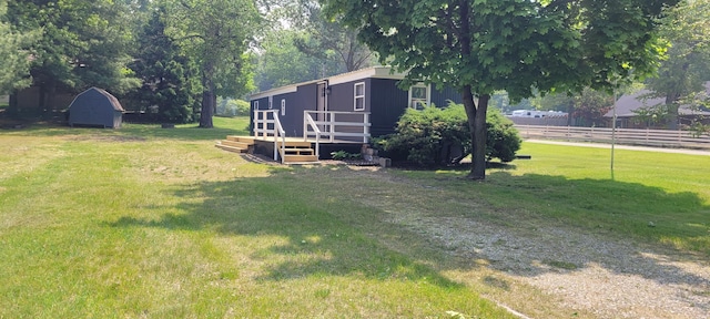 728 Crystal Ln, Mears, MI 49436 - view of yard featuring a wooden deck