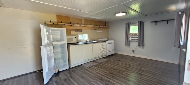 728 Crystal Ln, Mears, MI 49436 - kitchen with white appliances, dark wood finished floors, baseboards, white cabinetry, and a sink