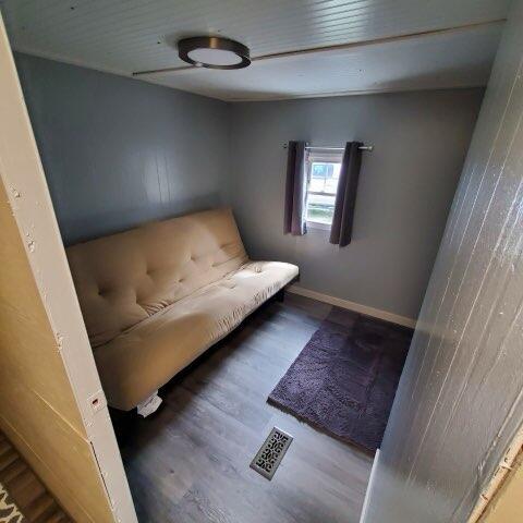 728 Crystal Ln, Mears, MI 49436 - sitting room featuring wood finished floors