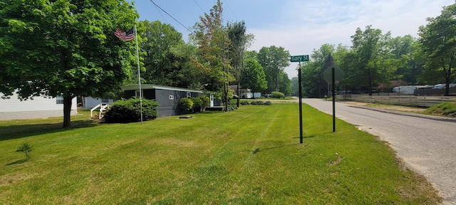 728 Crystal Ln, Mears, MI 49436 - view of asphalt street with traffic signs