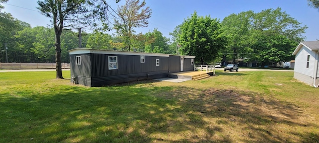 728 Crystal Ln, Mears, MI 49436 - rear view of property featuring a yard