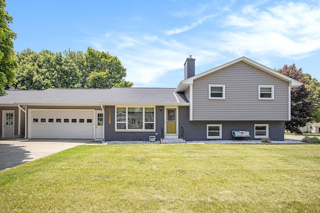 802 Kay St, Otsego, MI 49078 - split level home featuring a chimney, a garage, a front yard, and concrete driveway
