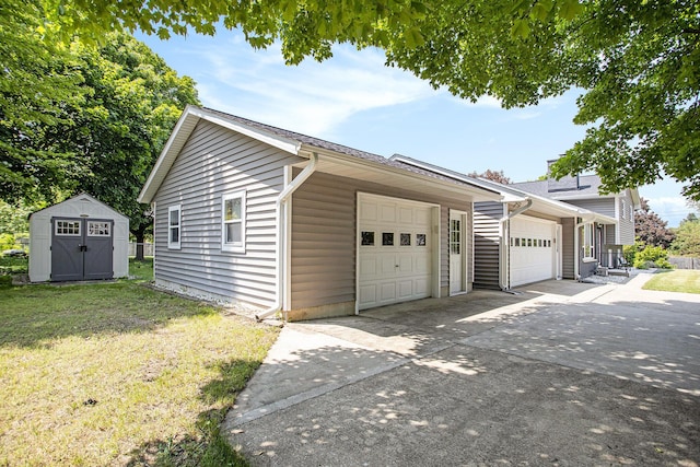 802 Kay St, Otsego, MI 49078 - garage with driveway and a shed