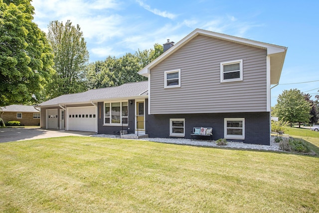 802 Kay St, Otsego, MI 49078 - tri-level home with a chimney, a garage, concrete driveway, and a front lawn