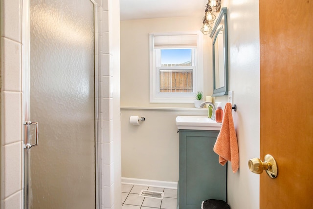 802 Kay St, Otsego, MI 49078 - full bath with tile patterned flooring, a shower stall, vanity, and baseboards