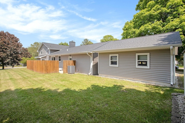 802 Kay St, Otsego, MI 49078 - back of property featuring cooling unit, a chimney, and roof with shingles