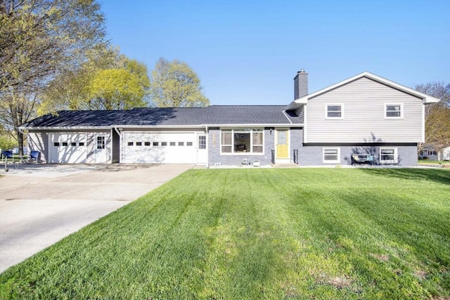 802 Kay St, Otsego, MI 49078 - view of front of house featuring a chimney, a front lawn, driveway, and an attached garage