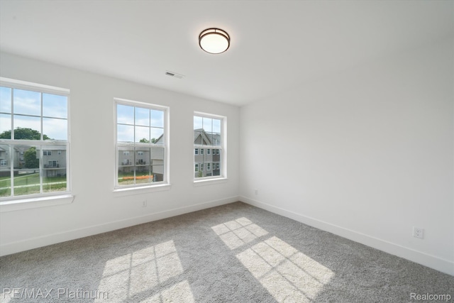 1689 Pinecroft Ln, Howell, MI 48855 - spare room featuring baseboards and carpet flooring