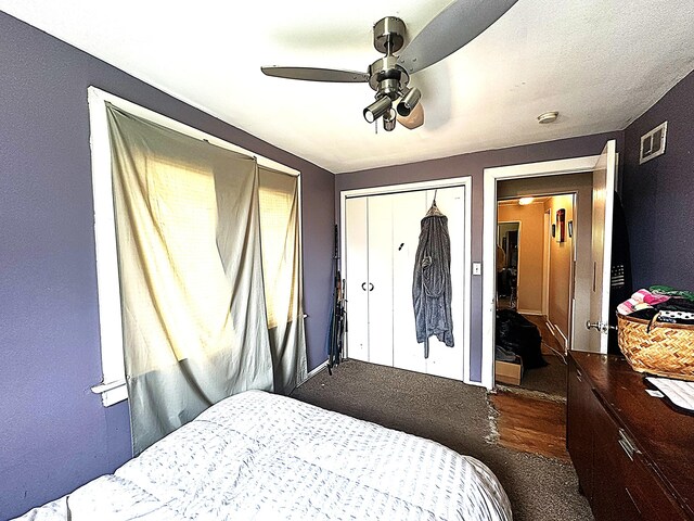 8632 Fremont St, Westland, MI 48185 - bedroom featuring baseboards, dark colored carpet, a ceiling fan, and a closet