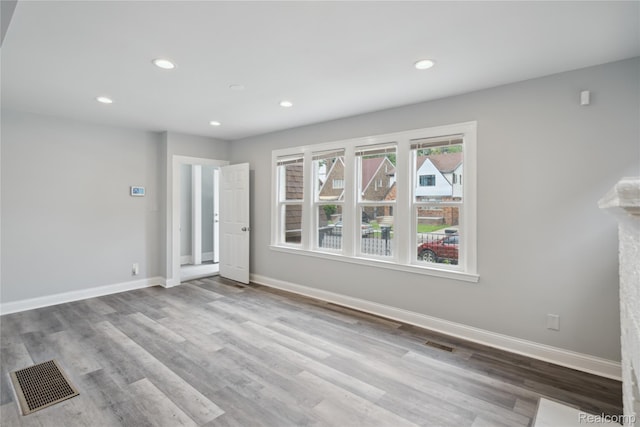 4835 Bedford St, Detroit, MI 48224 - unfurnished living room featuring wood finished floors, recessed lighting, and baseboards