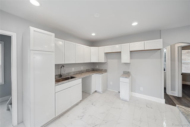 4835 Bedford St, Detroit, MI 48224 - kitchen featuring a sink, recessed lighting, white cabinets, baseboards, and light marble finish floors