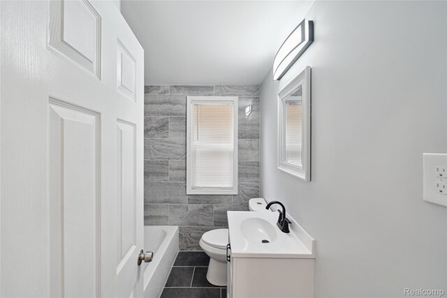 4835 Bedford St, Detroit, MI 48224 - bathroom featuring tile patterned floors, vanity, toilet, and shower / bathtub combination