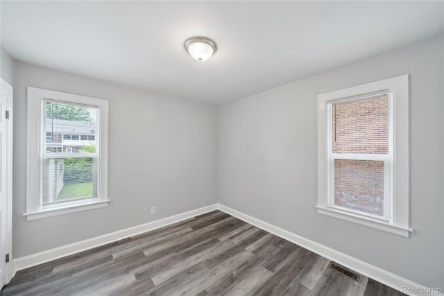 4835 Bedford St, Detroit, MI 48224 - spare room with dark wood-style flooring and baseboards