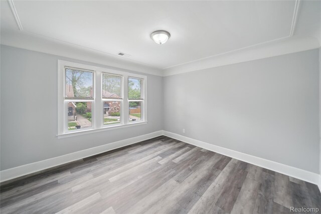 4835 Bedford St, Detroit, MI 48224 - spare room with wood finished floors and baseboards