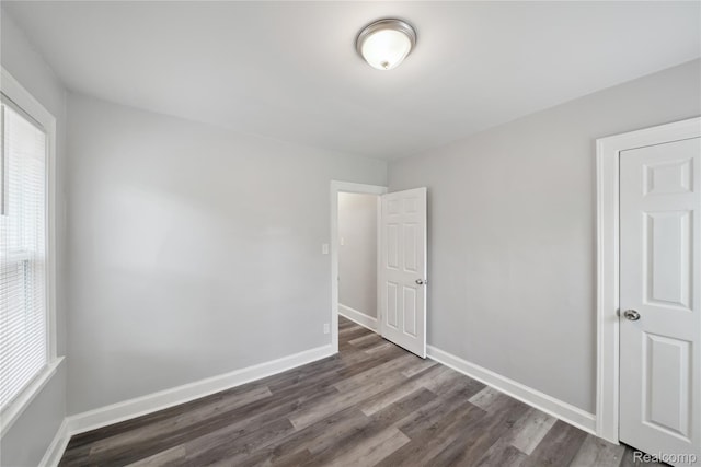 4835 Bedford St, Detroit, MI 48224 - spare room with dark wood finished floors and baseboards