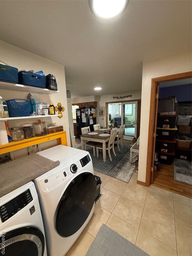 3454 Pine St, Hale, MI 48739 - laundry room featuring separate washer and dryer and light tile patterned flooring