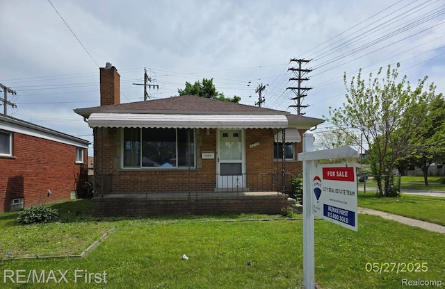 7210 Weingartz, Center Line, MI 48015 - bungalow-style home featuring a front lawn, brick siding, and a chimney
