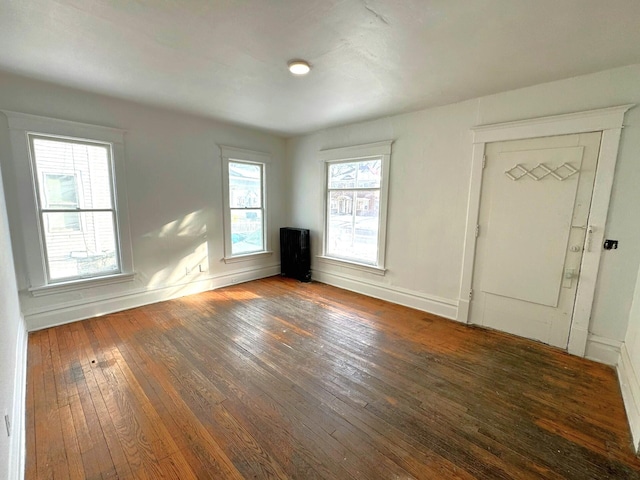 320 W Vine St, Kalamazoo, MI 49001 - spare room with wood-type flooring and baseboards