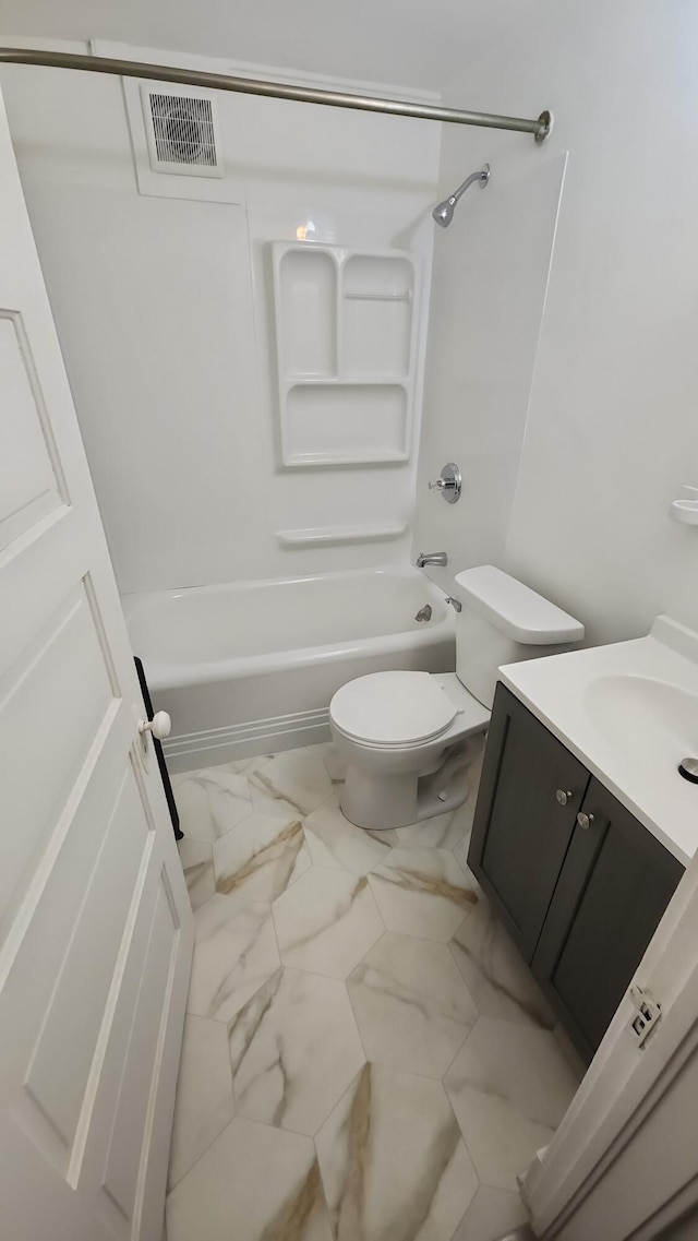 320 W Vine St, Kalamazoo, MI 49001 - bathroom featuring vanity, marble look tile flooring, shower / bath combination, and toilet