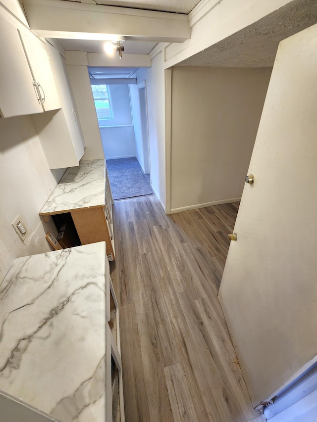 320 W Vine St, Kalamazoo, MI 49001 - kitchen with light wood-style flooring and white cabinets