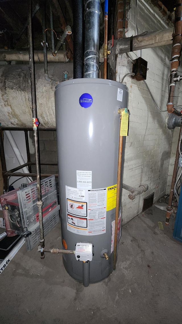 320 W Vine St, Kalamazoo, MI 49001 - utility room featuring water heater