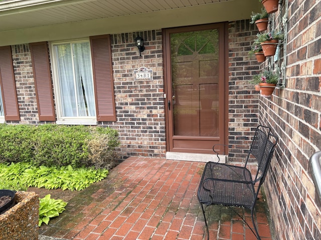 3481 Witherbee Dr, Troy, MI 48084 - property entrance featuring brick siding and a porch