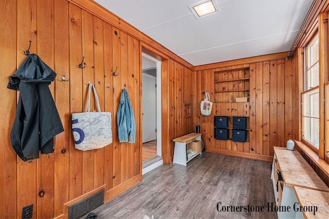 2308 Godwin Ave SE, Grand Rapids, MI 49507 - foyer with wooden walls, plenty of natural light, wood finished floors, and baseboards