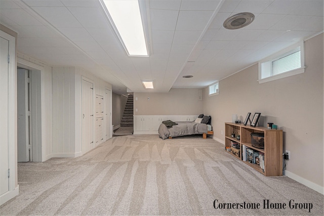2308 Godwin Ave SE, Grand Rapids, MI 49507 - below grade area featuring carpet, stairway, and baseboards