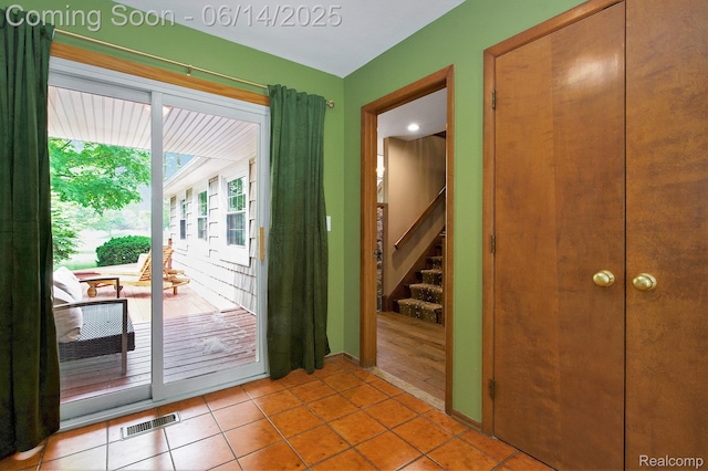 9818 Burning Tree Dr, Grand Blanc, MI 48439 - entryway with stairs and tile patterned floors