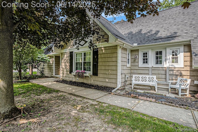 9818 Burning Tree Dr, Grand Blanc, MI 48439 - view of exterior entry featuring a shingled roof
