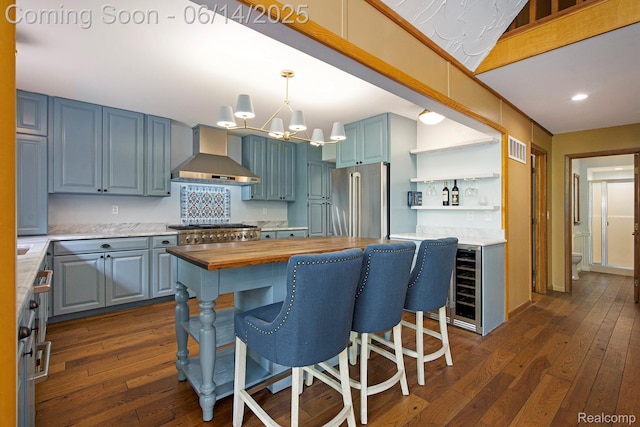 9818 Burning Tree Dr, Grand Blanc, MI 48439 - kitchen featuring wall chimney exhaust hood, butcher block countertops, high end fridge, dark wood-style floors, and open shelves