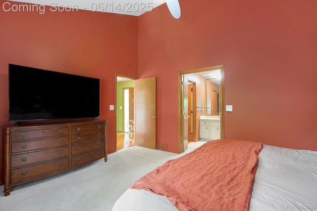9818 Burning Tree Dr, Grand Blanc, MI 48439 - carpeted bedroom featuring ensuite bath and a towering ceiling