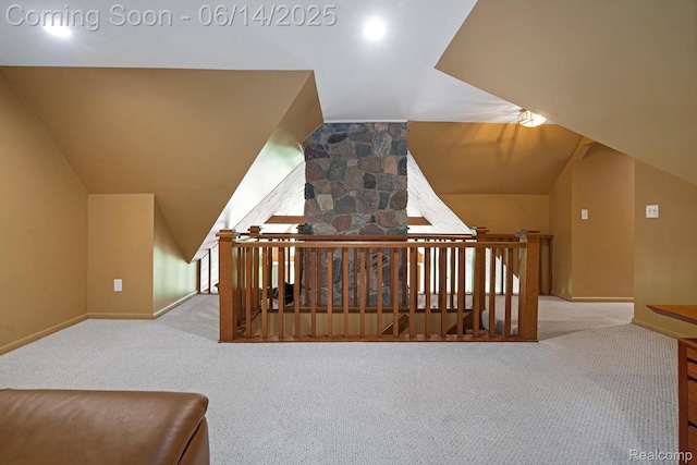 9818 Burning Tree Dr, Grand Blanc, MI 48439 - additional living space with carpet, vaulted ceiling, and baseboards
