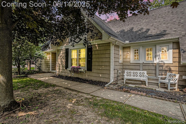 9818 Burning Tree Dr, Grand Blanc, MI 48439 - view of exterior entry with roof with shingles