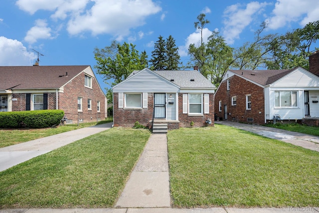 18930 Curtis St, Highland Park, MI 48219 - bungalow with brick siding and a front lawn