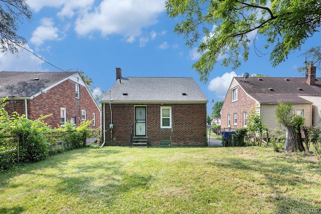 18930 Curtis St, Highland Park, MI 48219 - rear view of house with brick siding and a chimney