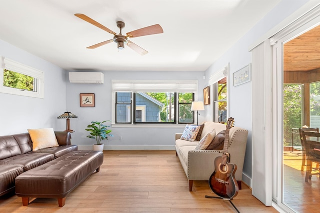 1308 Linwood Ave, Ann Arbor, MI 48103 - living room with a wall mounted AC, light wood-style flooring, ceiling fan, and baseboards