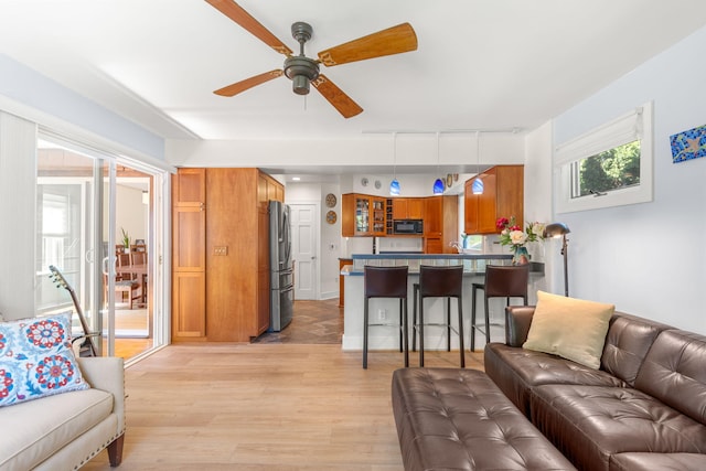 1308 Linwood Ave, Ann Arbor, MI 48103 - living room featuring a ceiling fan and light wood-style flooring