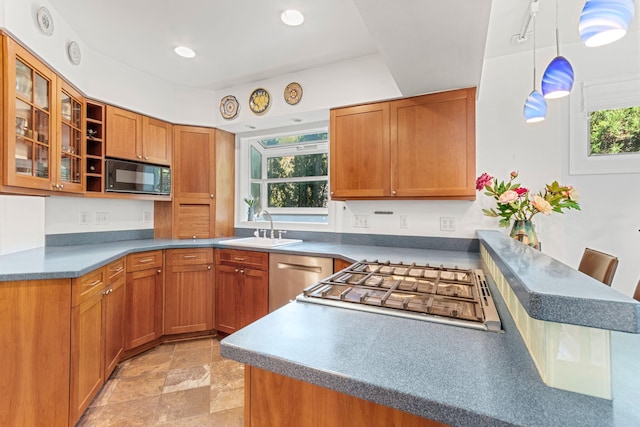 1308 Linwood Ave, Ann Arbor, MI 48103 - kitchen featuring black microwave, a sink, stainless steel dishwasher, cooktop, and brown cabinetry