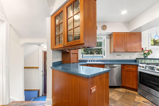 1308 Linwood Ave, Ann Arbor, MI 48103 - kitchen featuring stainless steel appliances, a sink, dark countertops, glass insert cabinets, and recessed lighting