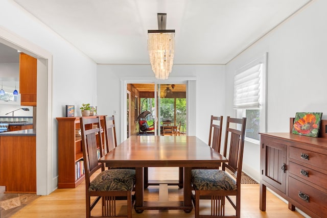 1308 Linwood Ave, Ann Arbor, MI 48103 - dining space featuring light wood-style flooring, plenty of natural light, and a chandelier