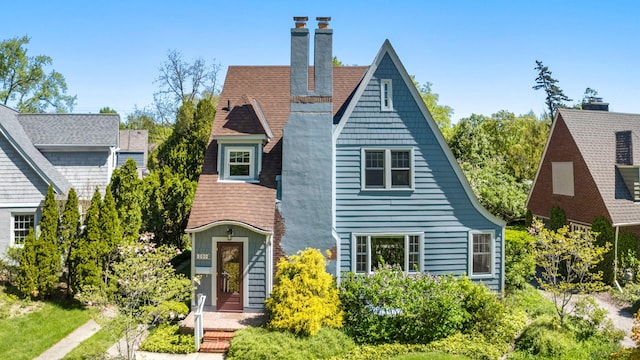 1308 Linwood Ave, Ann Arbor, MI 48103 - view of front facade with a chimney and roof with shingles