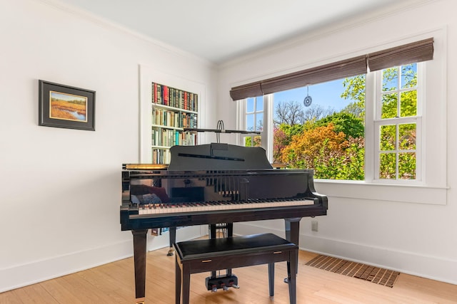 1308 Linwood Ave, Ann Arbor, MI 48103 - sitting room featuring crown molding, wood finished floors, and baseboards