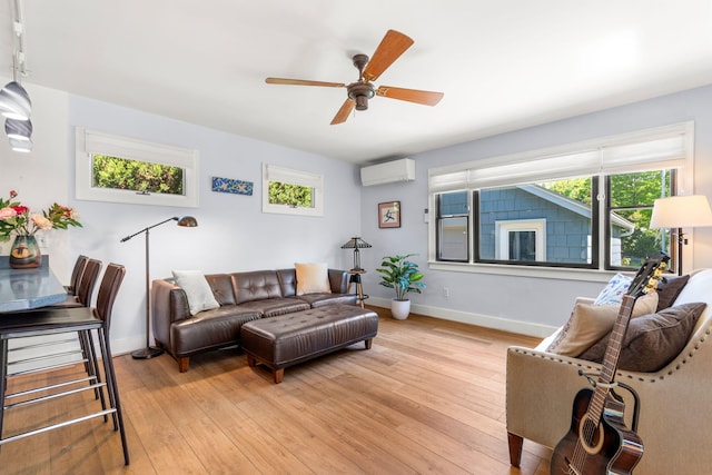 1308 Linwood Ave, Ann Arbor, MI 48103 - living area with a wall mounted air conditioner, a ceiling fan, baseboards, and light wood-type flooring