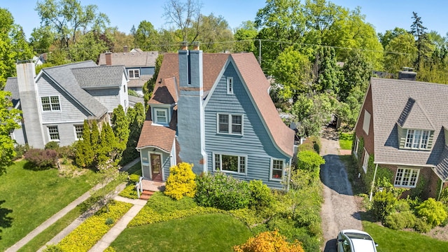 1308 Linwood Ave, Ann Arbor, MI 48103 - view of front facade featuring a chimney, dirt driveway, and roof with shingles