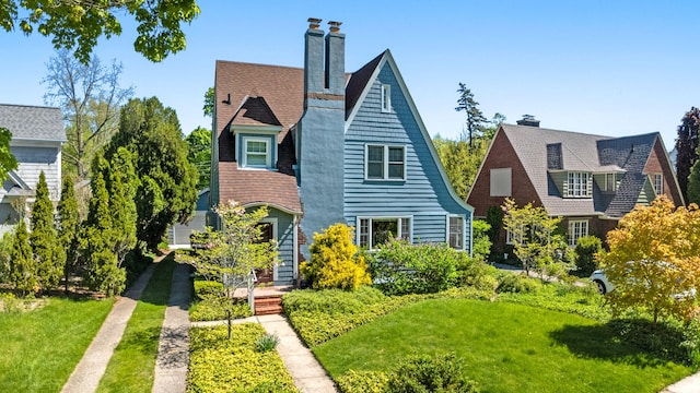 1308 Linwood Ave, Ann Arbor, MI 48103 - view of front facade with a front yard and a chimney